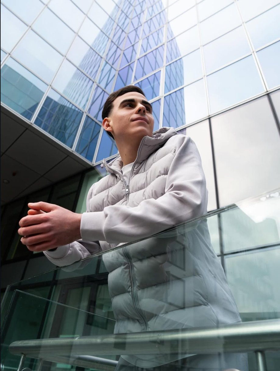 AURUM Hybrid Jacket by a glass tower in Dublin