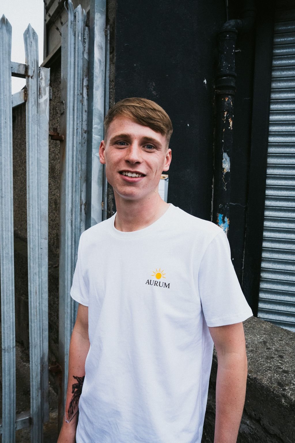 AURUM tee in white with sun logo